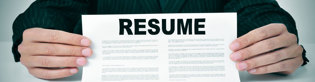 a man wearing a suit showing his resume